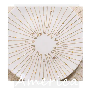 Detailed top view of 26 alphabet necklaces with tiny gold hearts and sparkling crystals