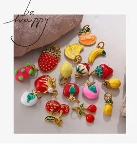 Close-up of colorful fruit-themed alloy oil-drop charms for DIY jewelry and crafts