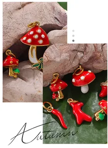 Detail of autumn-themed mushroom and pepper enamel pendants with crystal details