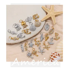 Detailed macro view of assorted ocean-themed rhinestone pendants in gold and silver finish