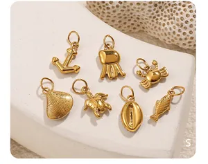 Detail of seven golden ocean-themed pendants including seahorse and turtle with rhinestones