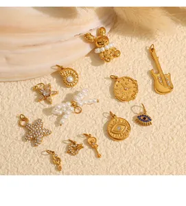 Detailed assortment of DIY 18K gold plated charms with pearls and celestial shapes