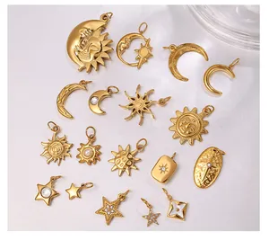 Close-up of 18K gold plated celestial pendants featuring sun, moon and star designs