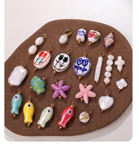DIY jewelry parts set with ceramic fish pendants and 18K gold plated pearl charms