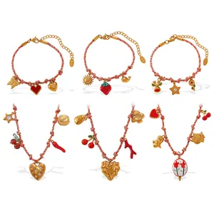 Red braided rope jewelry set with gold pendants in heart star and cherry shapes