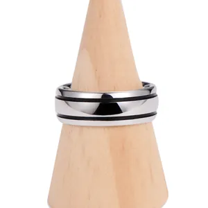 Polished tungsten steel ring with double black stripes on a wooden display stand