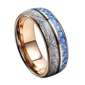 Rose gold tungsten ring with blue carbon fiber inlay and meteorite texture finish