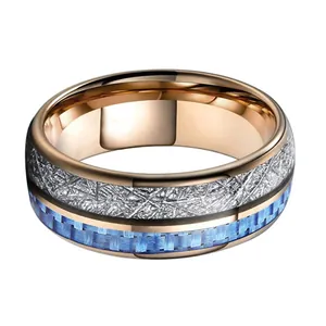 Rose gold tungsten ring with silver meteorite texture and blue carbon fiber inlay