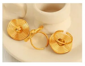 Macro shot of 18K gold plated titanium ring with straw hat spiral texture design