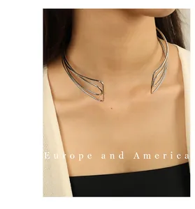 Detail of silver multi-layer metal choker with minimalist open cuff streamline design
