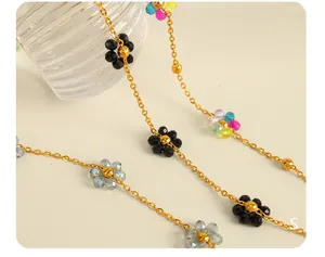 Macro shot of 18k gold plated chain with handmade colorful crystal floral elements