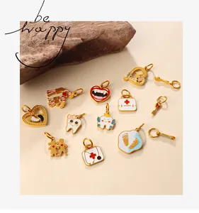 Detailed close-up of creative medical-themed charms with gold-plated finish and enamel art