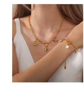 Detail of chunky gold chain necklace and bracelet with creative medical-themed charms