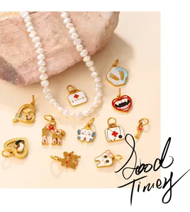 Close-up of assorted medical themed enamel charms on a white baroque pearl necklace