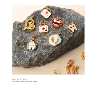Detailed close-up of creative medical-themed enamel charms on a natural stone base