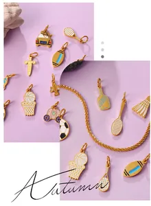 Detailed shot of gold-plated sports and lifestyle enamel charms on twist chains