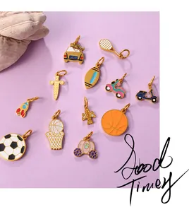 Macro view of twelve colorful enamel sports and transport charms on purple background
