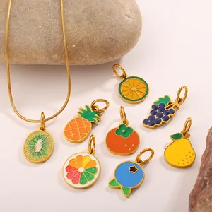 Gold snake chain necklace set with colorful enamel fruit charms including pineapple and lemon