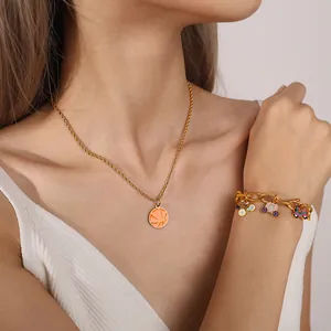 Gold charm necklace and bracelet set featuring colorful basketball and bicycle pendants
