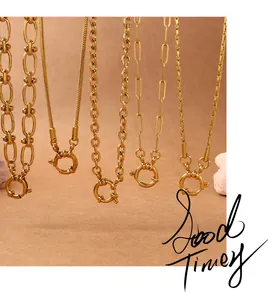 Detail view of five assorted gold necklaces featuring bold links and spring ring clasps