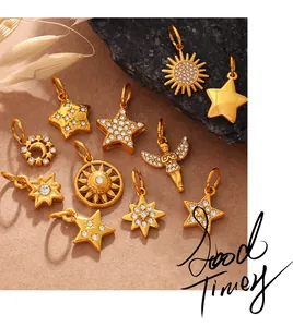 Detail of gold star moon and angel pendants with sparkling zircon crystal inlays