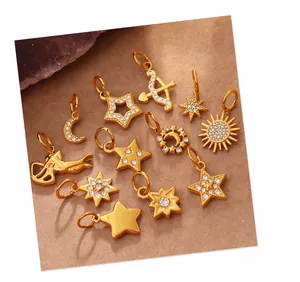 Detail shot of gold-plated star, moon, and sun pendants with sparkling rhinestones