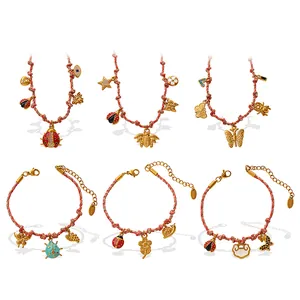 Stainless steel beaded jewelry set with red cord and gold flower heart charms