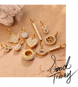 Close-up of assorted gold-plated pendants with micro-pave zircons for DIY jewelry