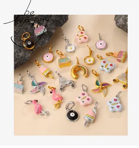 Macro detail of assorted colorful enamel charms like ice cream and rainbow with gold plating