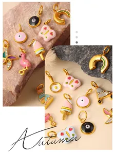 Detail of colorful enamel charms including rainbow, evil eye, and ice cream on gold metal