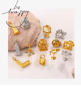 Detailed close-up of mixed gold and silver landmark charms and cocktail glass pendants