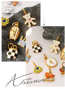Macro shot of colorful enamel charms featuring checkerboard bag and cute bear pendant