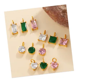 Detailed view of assorted geometric zircon pendants with gold plated settings
