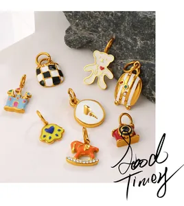 Detailed close-up of colorful enamel charms featuring bear, checkerboard bag, and castle