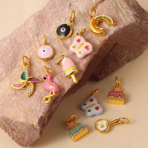 Exquisite gold enamel pendants featuring evil eye, rainbow, and quirky ice cream designs