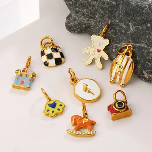 Charming enamel teddy bear and checkerboard bag charm set with golden metal finish