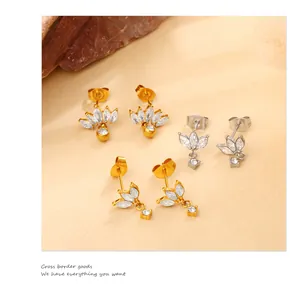 Detailed view of marquise-cut zircon leaf stud earrings in gold and silver plating