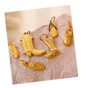 Detailed view of six gold boot charms with rhinestones and enamel for DIY jewelry