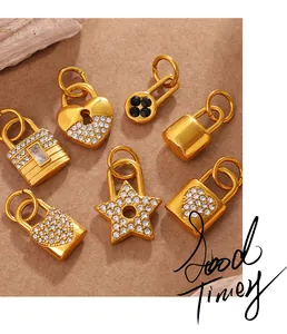 Detail of gold-plated heart and star-shaped lock pendants with sparkling rhinestones