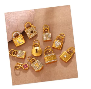 Detailed flat lay of assorted gold-plated lock pendants with rhinestones and heart motifs