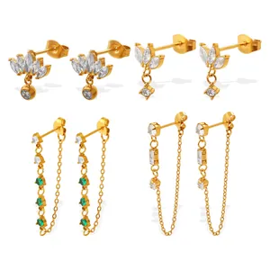 Set of four gold-tone heart and chain stud earrings featuring green and clear zircons
