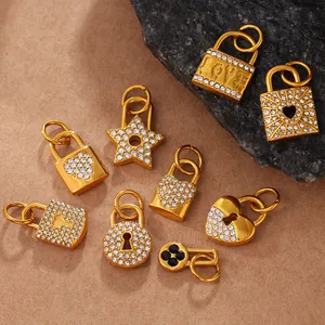 Golden heart, star, and lock pendants set with sparkling rhinestones and clover details