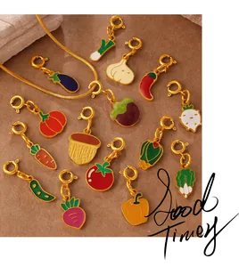 Detail of colorful enamel vegetable charms with lobster clasps on a golden snake chain