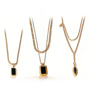 Three-piece gold figaro necklaces featuring vintage black geometric square and oval pendants