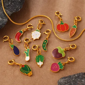 Vegetable enamel charms set with carrot and chili pendants on a gold snake chain necklace