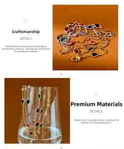 Detailed shot of brass necklaces with teardrop and heart-shaped colorful gemstones