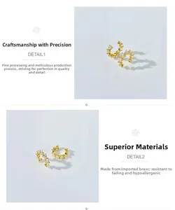 Detail view of gold crescent ear cuffs featuring heart-cut cubic zirconia and C-shape design
