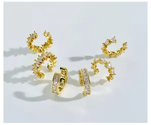Close-up of gold plated ear cuff set with square and heart shape cubic zirconia