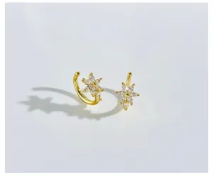 Macro detail of gold flower ear cuff featuring marquise-cut marquise cubic zirconia petals