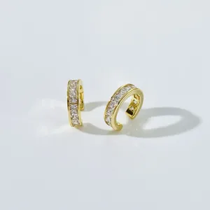 Gold C-shaped crescent earrings with square diamonds and sparkling zircon stones